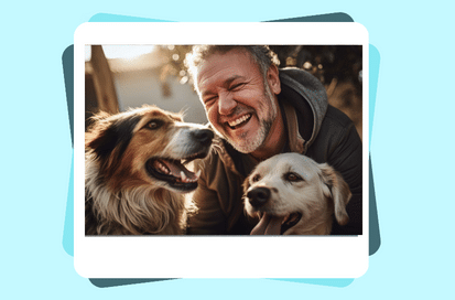 man playing with his two dogs.